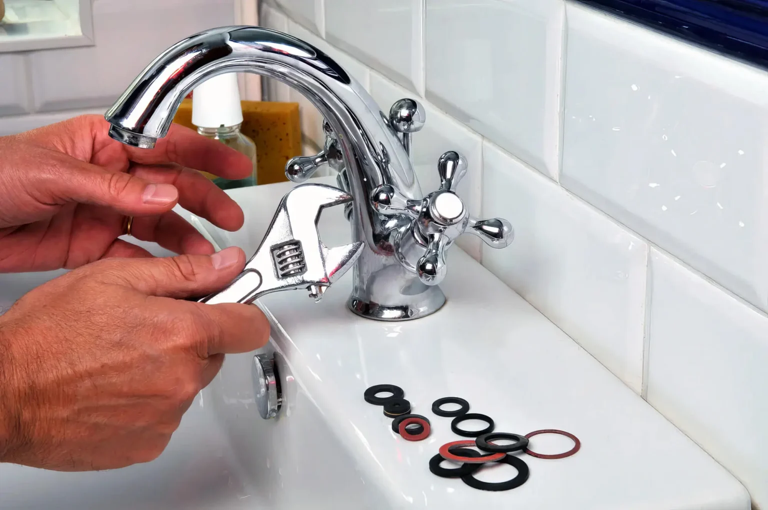 Plumber maintaining a bathroom faucet in Newport Beach