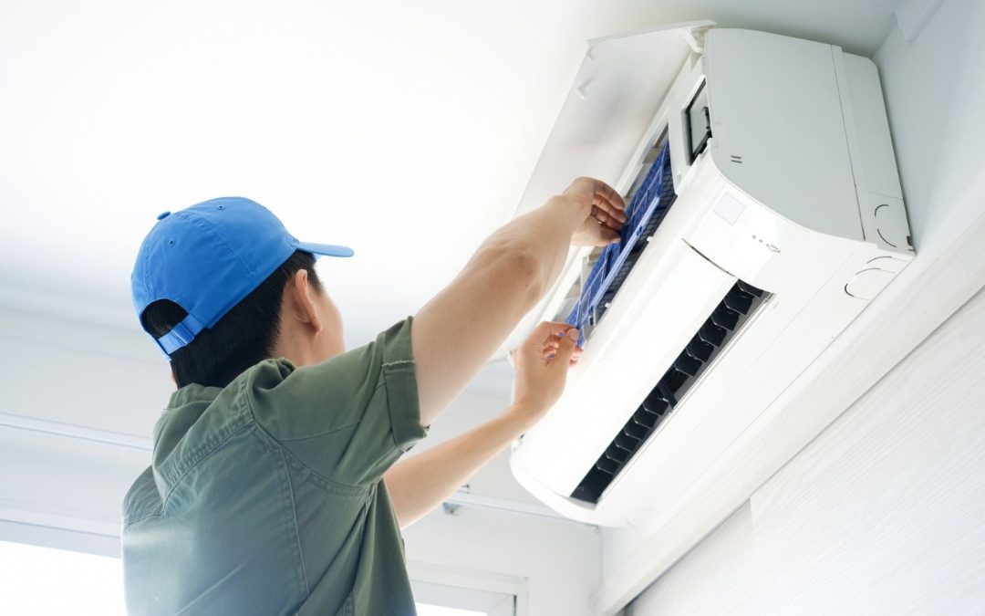 HVAC technician servicing a ductless mini split in Newport Beach