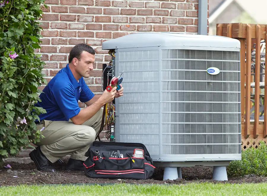 HVAC technician inspecting an outdoor AC unit in Newport Beach